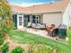 Inviting backyard with a patio area perfect for outdoor entertaining and relaxation at 2124 Westchester Way, The Villages, FL 32162