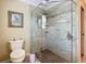 Modern bathroom showcasing a glass-enclosed shower with decorative tile and updated fixtures at 2124 Westchester Way, The Villages, FL 32162