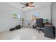 Bright bedroom featuring neutral walls, ceiling fan, and ample natural light, perfect as office at 2240 Archer Blvd, Orlando, FL 32833