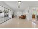 Bright living room featuring modern sliding doors and neutral finishes with modern furniture at 2240 Archer Blvd, Orlando, FL 32833