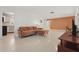 Open living space featuring neutral color palette, modern lighting, and access to the kitchen at 2240 Archer Blvd, Orlando, FL 32833