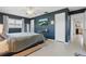 Bright main bedroom offering natural light, ceiling fan, access to bath, and sleek flooring at 2240 Archer Blvd, Orlando, FL 32833