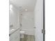 Bathroom with white tiled tub, shower and granite vanity at 23810 Sw Indian Hill Dr, Dunnellon, FL 34431