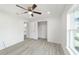 Bedroom showcasing a ceiling fan, closet and modern wood floors at 23810 Sw Indian Hill Dr, Dunnellon, FL 34431