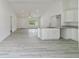 Open kitchen island with granite countertop overlooks living room and front entry at 23810 Sw Indian Hill Dr, Dunnellon, FL 34431