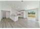 Bright kitchen with white cabinetry, granite countertops, and stainless sink at 23810 Sw Indian Hill Dr, Dunnellon, FL 34431