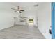 Open-concept living space with modern flooring and a view of the kitchen and backyard at 23810 Sw Indian Hill Dr, Dunnellon, FL 34431