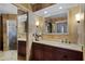 Stylish bathroom featuring a sleek vanity with a single sink and tiled shower with a modern glass door at 257 Donegal Ct, Altamonte Springs, FL 32714