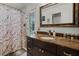 Bathroom featuring dark vanity with marble countertop and shower with marble curtain at 257 Donegal Ct, Altamonte Springs, FL 32714