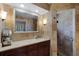 Bathroom features a large mirror, a single sink, and tile walls that include a glass enclosed shower at 257 Donegal Ct, Altamonte Springs, FL 32714