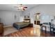 Comfortable bedroom with wood floors, soft colors, and a view to the bathroom at 257 Donegal Ct, Altamonte Springs, FL 32714