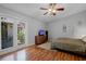 Cozy bedroom with wood flooring, neutral walls, and access to the outdoors at 257 Donegal Ct, Altamonte Springs, FL 32714