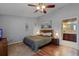 Comfortable bedroom with wood floors, soft colors, and a view to the bathroom at 257 Donegal Ct, Altamonte Springs, FL 32714