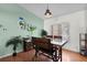 This dining area features a vintage-style table set and a light green accent wall at 257 Donegal Ct, Altamonte Springs, FL 32714