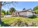 Charming home featuring a white picket fence, lush lawn, and tropical landscaping at 257 Donegal Ct, Altamonte Springs, FL 32714