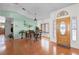 Home foyer showcases hardwood floors and a wooden front door and offers a view of the dining room at 257 Donegal Ct, Altamonte Springs, FL 32714