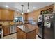 Well-equipped kitchen featuring an island, custom cabinets, and stainless steel appliances at 257 Donegal Ct, Altamonte Springs, FL 32714