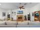 Living room featuring a stacked stone fireplace, built-in shelving, and a comfortable sectional sofa at 257 Donegal Ct, Altamonte Springs, FL 32714