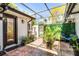 Screened-in patio with brick flooring and lush plants, perfect for outdoor living at 257 Donegal Ct, Altamonte Springs, FL 32714