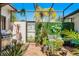 Outdoor patio area with a grill, seating, and decorative greenery for entertainment at 257 Donegal Ct, Altamonte Springs, FL 32714