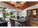 Inviting covered patio with tile flooring, wood ceiling, fan, furniture, and vibrant plants at 257 Donegal Ct, Altamonte Springs, FL 32714