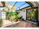 Enclosed patio featuring outdoor seating and lush greenery for relaxing and entertaining at 257 Donegal Ct, Altamonte Springs, FL 32714