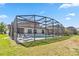 Lush backyard showcasing an enclosed swimming pool at 2723 Callaway Ln, Kissimmee, FL 34744