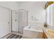 Bright bathroom featuring separate shower and tub, plus vanity at 2723 Callaway Ln, Kissimmee, FL 34744