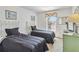 Bedroom with twin beds and natural light from large window at 2723 Callaway Ln, Kissimmee, FL 34744