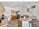 Modern kitchen with wood cabinets, stainless steel appliances, and bar seating at 2723 Callaway Ln, Kissimmee, FL 34744