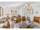 Bright living room with decorative chandelier, comfortable furniture, and large windows at 2723 Callaway Ln, Kissimmee, FL 34744