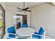 Cozy patio with a ceiling fan and seating area at 2723 Callaway Ln, Kissimmee, FL 34744