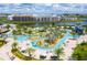 Resort-style amenity center with lazy river, waterslides, and poolside seating at 2964 Protagonist St, Kissimmee, FL 34746