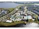 Expansive aerial view of a Primary-planned community with resort-style amenities and lake access at 2964 Protagonist St, Kissimmee, FL 34746