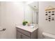Bright bathroom features a modern vanity with white countertop and decorative accents at 2964 Protagonist St, Kissimmee, FL 34746