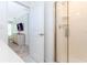 An accessible bathroom has a shower and a bedroom visible through the doorway at 2964 Protagonist St, Kissimmee, FL 34746
