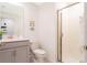 This modern bathroom offers a walk-in shower, a single sink, and white cabinets at 2964 Protagonist St, Kissimmee, FL 34746