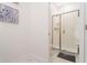 Clean bathroom with glass-enclosed shower and white tiled walls providing a sleek, modern feel at 2964 Protagonist St, Kissimmee, FL 34746