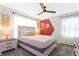 Neutral bedroom with ceiling fan, decorative textiles, and plenty of natural light at 2964 Protagonist St, Kissimmee, FL 34746