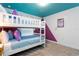 White bunk beds with blue bedding sit in a themed bedroom with Frozen decorations at 2964 Protagonist St, Kissimmee, FL 34746