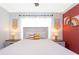 Bright and airy bedroom with a king-sized bed, decorative accents, and modern lighting at 2964 Protagonist St, Kissimmee, FL 34746