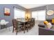 Bright dining room features a large table with seating for eight, next to the living area at 2964 Protagonist St, Kissimmee, FL 34746