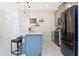 Modern kitchen with stainless steel appliances, breakfast bar, and stylish pendant lighting at 2964 Protagonist St, Kissimmee, FL 34746