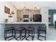 Stylish kitchen with quartz countertops, stainless steel appliances, and modern pendant lighting at 2964 Protagonist St, Kissimmee, FL 34746