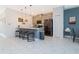 Bright kitchen featuring a breakfast bar, stainless steel appliances, and plenty of cabinet space at 2964 Protagonist St, Kissimmee, FL 34746