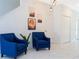 Cozy living room area with stylish blue armchairs, and modern decor at 2964 Protagonist St, Kissimmee, FL 34746
