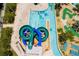 Aerial view of the community water slides and lazy river with mini golf course at 2964 Protagonist St, Kissimmee, FL 34746