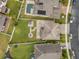 Overhead view of the property with a well-maintained backyard, patio, fire pit, and lush greenery at 3087 Somerset Park Dr, Orlando, FL 32824
