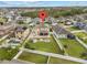 Aerial view of property featuring a large backyard with a patio, fire pit, and well-manicured lawn at 3087 Somerset Park Dr, Orlando, FL 32824