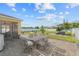 Spacious backyard with seating, a patio, a fire pit, and lush landscaping, perfect for outdoor living at 3087 Somerset Park Dr, Orlando, FL 32824